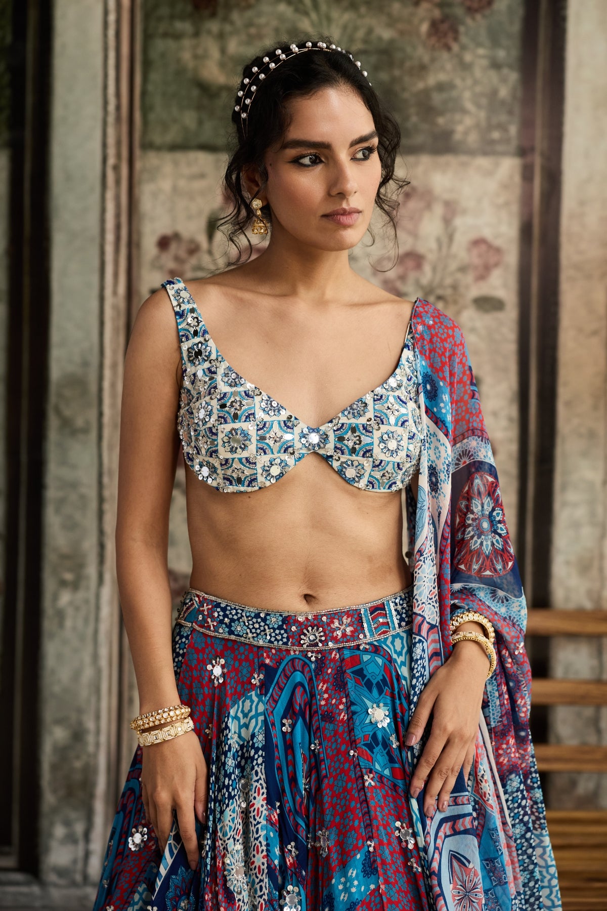 IVORY BUTTA PRINT AND HIGHLIGHTED BLOUSE WITH TEAL PRINT AND HIGHLIGHTED LEHENGA SET