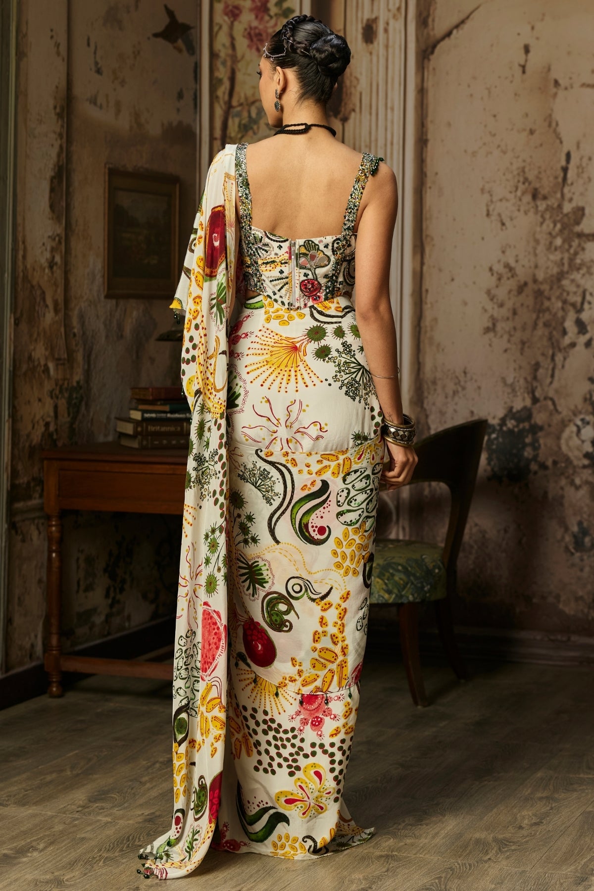 IVORY PRINT AND HIGHLIGHTED CORSET WITH DHOTI SKIRT SAREE SET