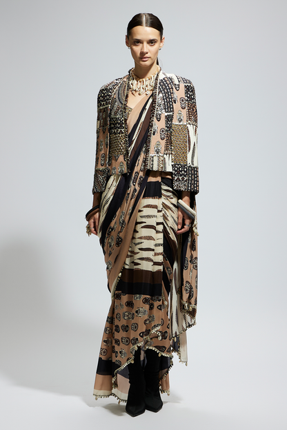 Mask and Feather Print Cascade Saree Paired with Metallic Scallop Bustier with Patchwork Cape Jacket