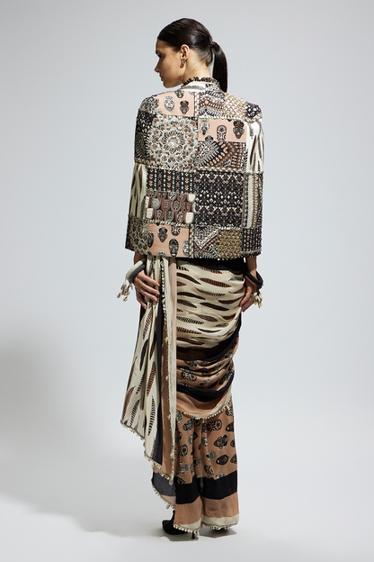 Mask and Feather Print Cascade Saree Paired with Metallic Scallop Bustier with Patchwork Cape Jacket