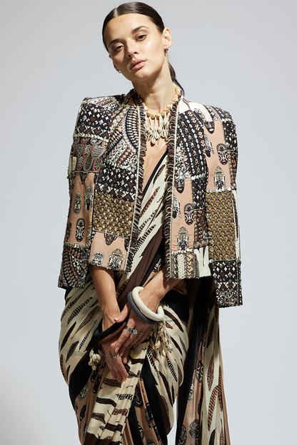Mask and Feather Print Cascade Saree Paired with Metallic Scallop Bustier with Patchwork Cape Jacket