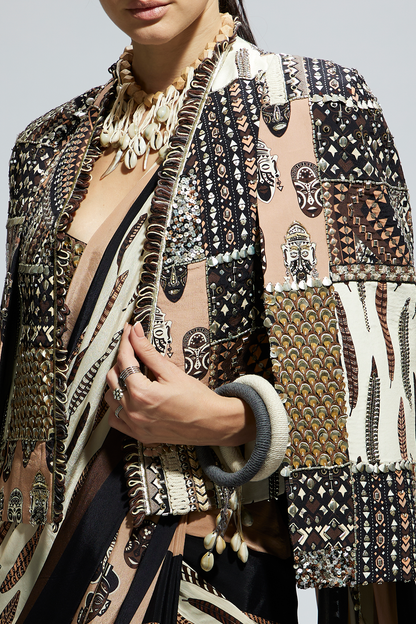 Mask and Feather Print Cascade Saree Paired with Metallic Scallop Bustier with Patchwork Cape Jacket