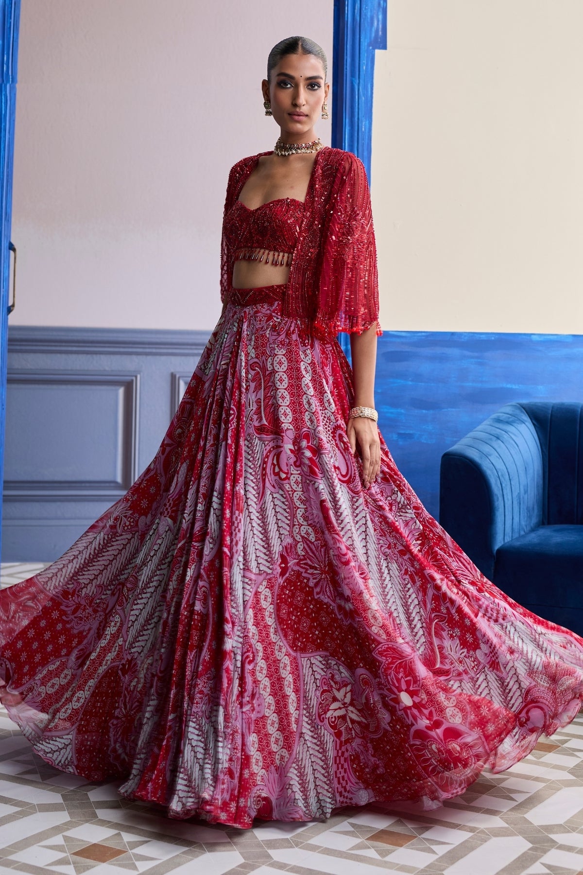 RED EMBROIDERED BLOUSE WITH TASSEL CAPE JACKET & FLORAL LEHENGA SET