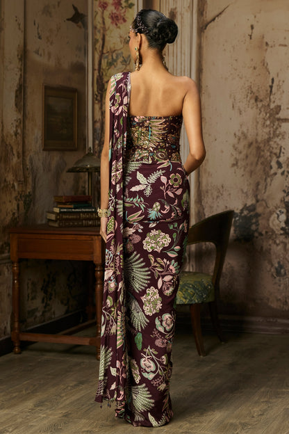 PLUM PRINTED AND HIGHLIGHTED CORSET WITH DHOTI SKIRT SAREE SET