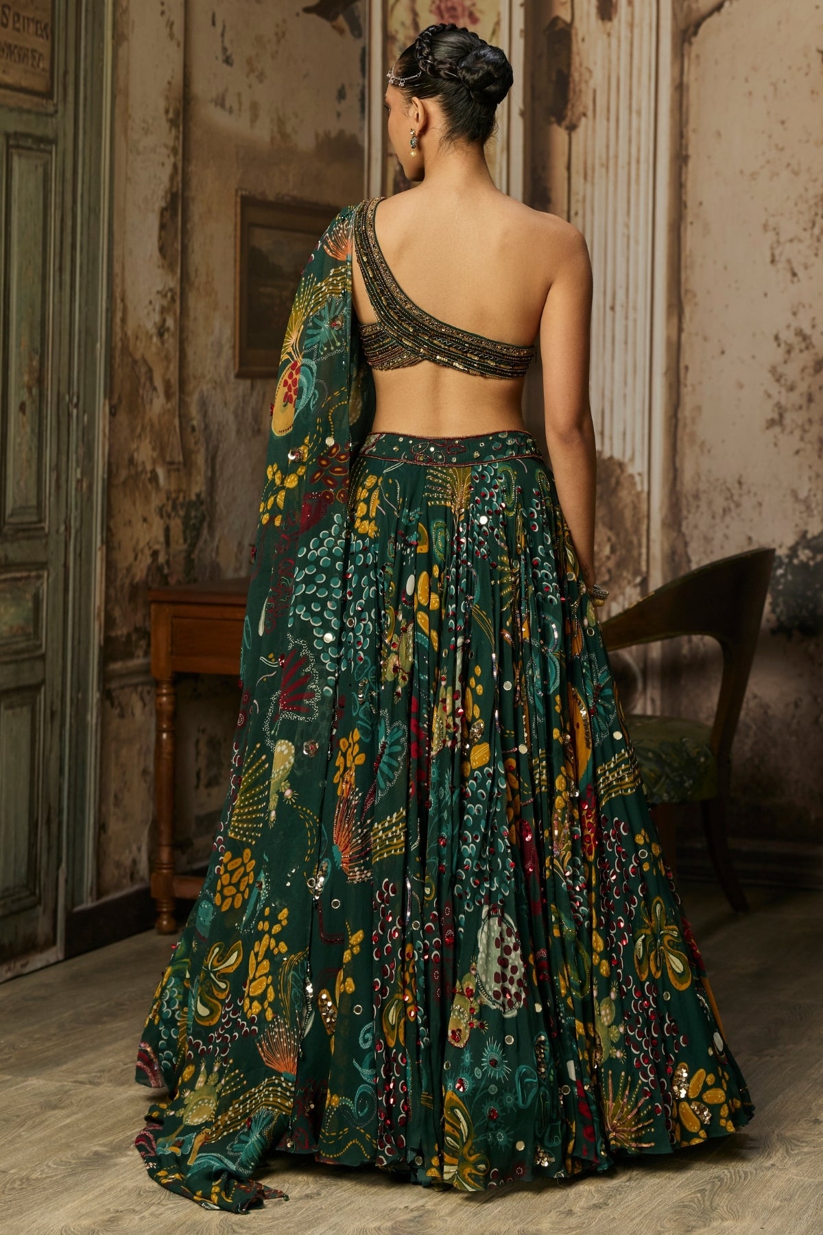 DARK GREEN EMBELLISHED BOUSE WITH PRINTED AND HIGHLIGHTED LEHENGA SET