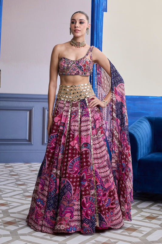 FUCHSIA FLORAL ONE-SHOULDER DRAPE BLOUSE WITH MIRROR LEHENGA SET
