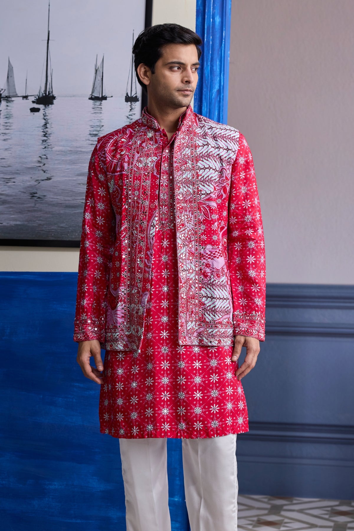 RED PRINT HIGHLIGHTED  KURTA WITH PRINT EMBROIDERED BUNDI AND IVORY PANTS
