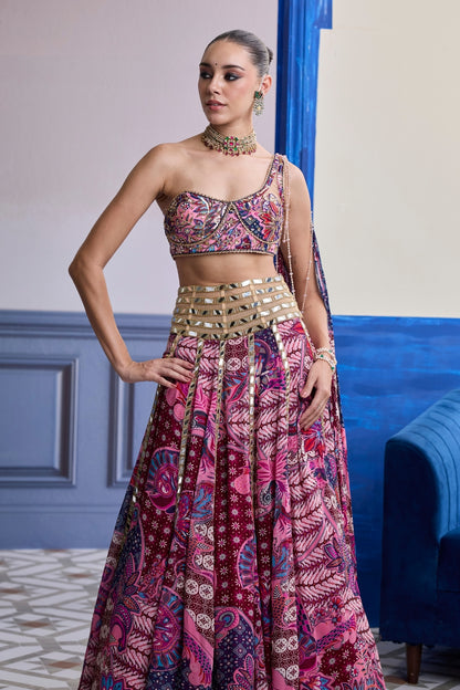 FUCHSIA FLORAL ONE-SHOULDER DRAPE BLOUSE WITH MIRROR LEHENGA SET