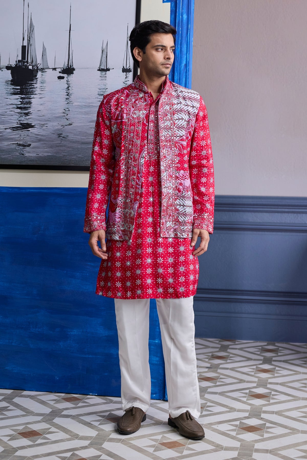 RED PRINT HIGHLIGHTED  KURTA WITH PRINT EMBROIDERED BUNDI AND IVORY PANTS