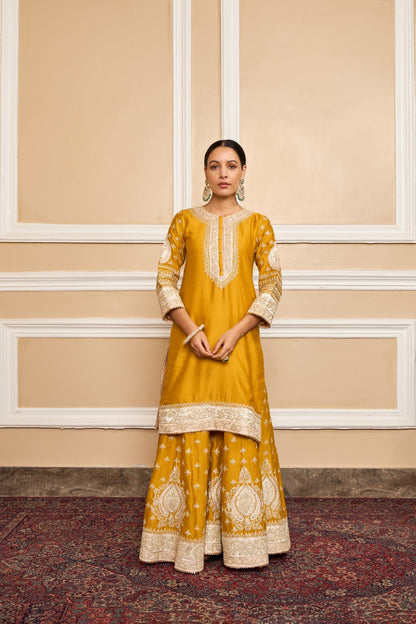 Muskan Chanana in Raina - Glaze Mustard Short Kurta with Sharara and Odhni